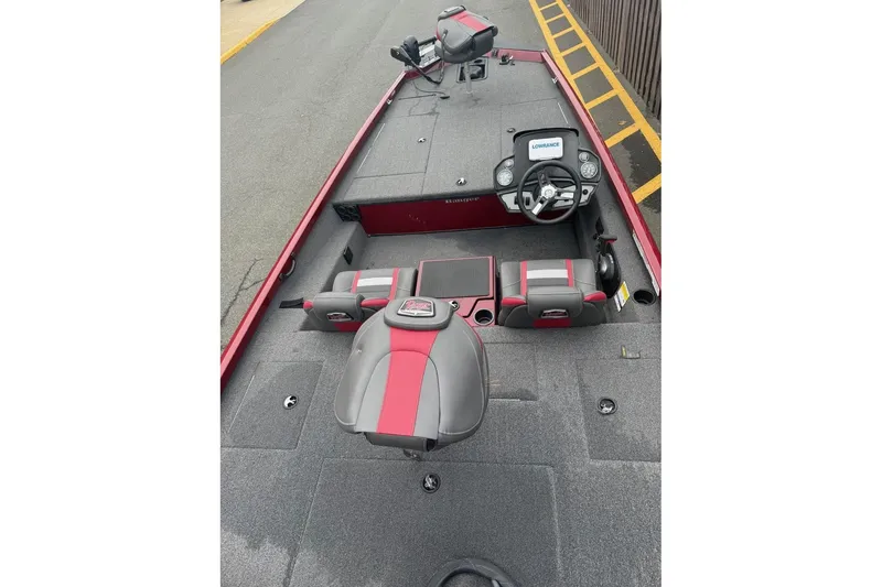 Slide: The Image of 2020 Ranger RT188 boat interior with steering console and seating, featuring red and gray accents. - 2