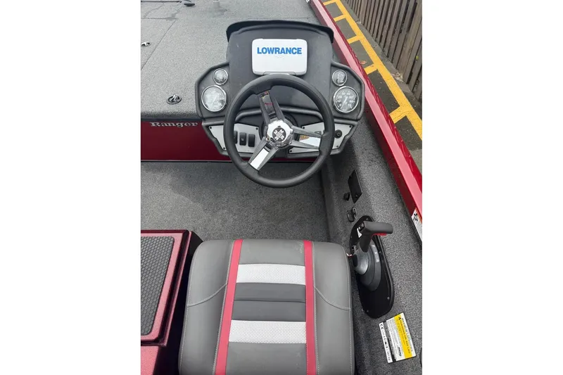 Slide: The Image of 2020 Ranger RT188 boat cockpit with steering wheel and Lowrance display. - 3