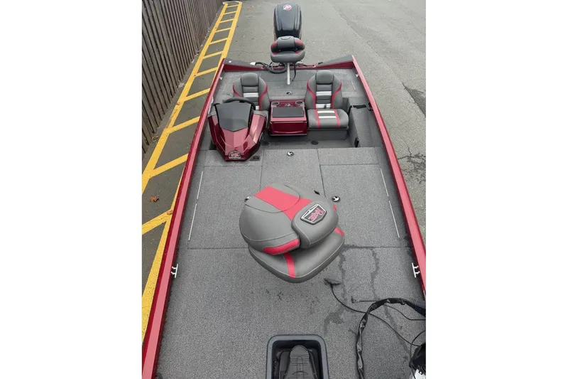 Slide: The Image of 2020 Ranger RT188 fishing boat interior with red and gray seating and spacious deck. - 4