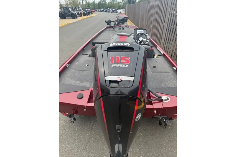 Slide: The Image of 2020 Ranger RT188 boat with Mercury 115 Pro outboard motor, parked on pavement. - 5
