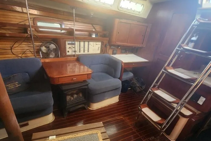 Slide: The Image of Interior of a 1993 Catalina Morgan 381 yacht with blue seating. - 10