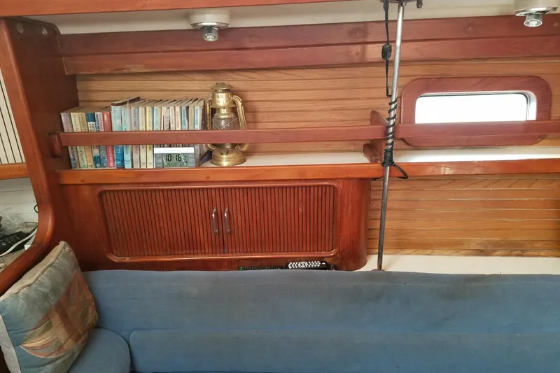 Slide: The Image of Interior of 1993 Catalina Morgan 381 sailboat with bookshelf and lantern. - 14