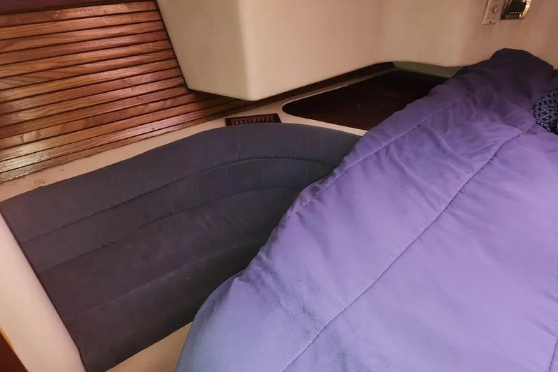 Slide: The Image of Interior cabin of 1993 Catalina Morgan 381 sailboat with blue bedding. - 20