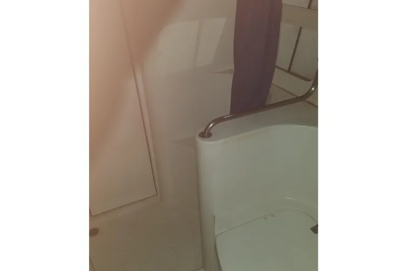 Slide: The Image of Interior of 1993 Catalina Morgan 381 yacht bathroom with shower and handrail. - 24