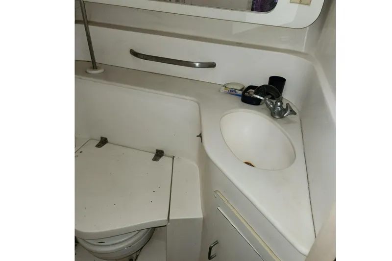 Slide: The Image of Bathroom interior of 1993 Catalina Morgan 381 yacht, featuring sink and toilet. - 25