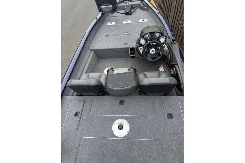 Slide: The Image of 2020 Tracker Pro Team 175 TF boat interior with dual seats and steering console. - 2