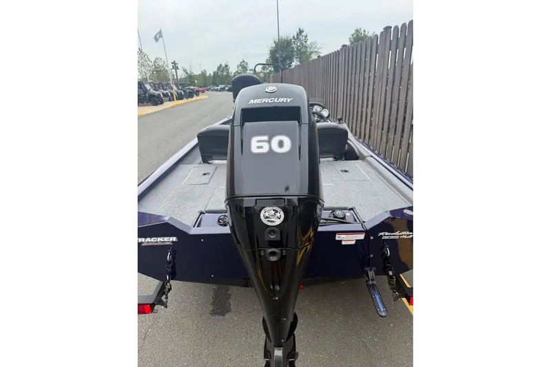 Slide: The Image of 2020 Tracker Pro Team 175 TF boat with Mercury 60 engine, parked outdoors. - 5