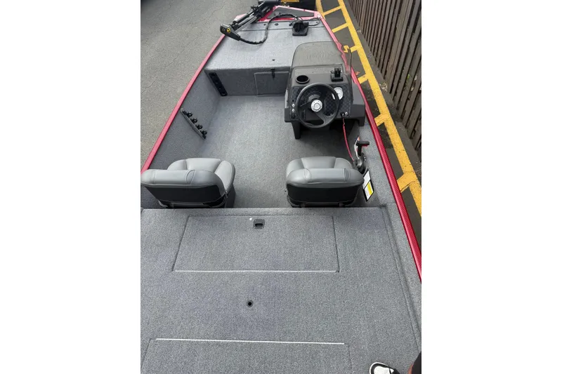 Slide: The Image of 2023 Tracker Bass Tracker Classic XL boat interior with steering console and seating. - 3