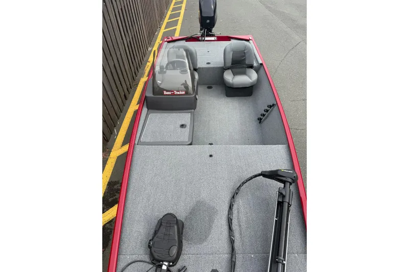 Slide: The Image of 2023 Tracker Bass Tracker Classic XL boat interior with seating and controls. - 4