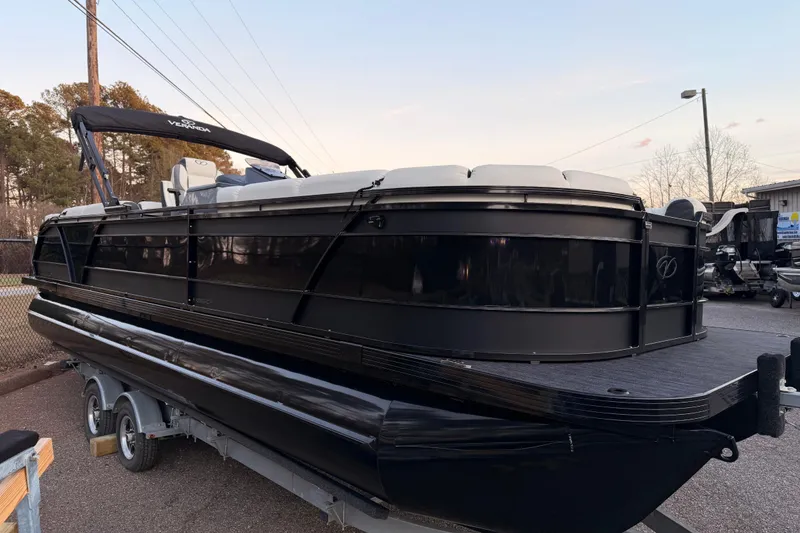 Slide: The Image of 2026 Veranda VR 265 RCP pontoon boat on trailer, black exterior, parked outdoors. - 3