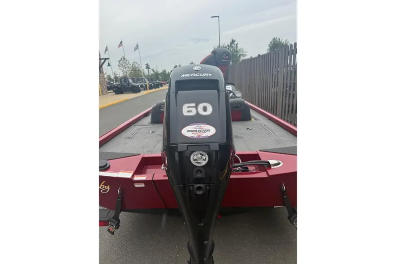 Slide: The Image of 2021 Ranger RT178 boat with Mercury 60 engine, parked outdoors. - 6