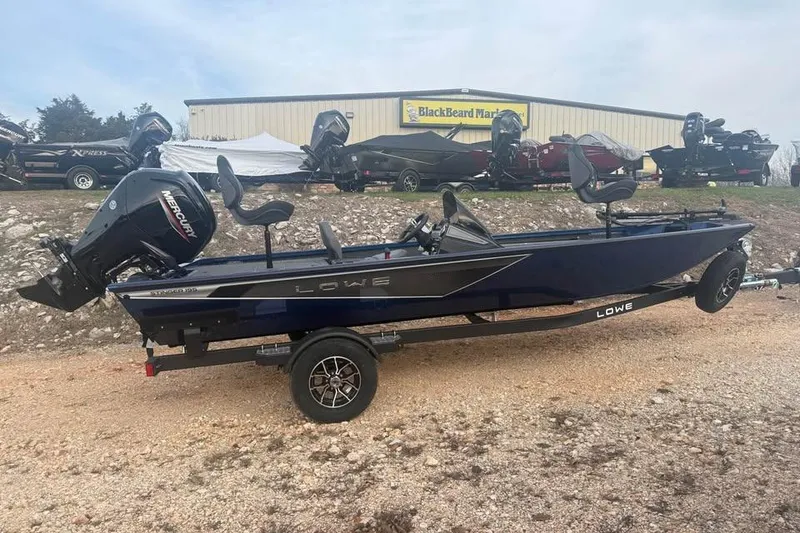 The Image of 2026 Lowe Stinger 195 Bass boat with Mercury engine on trailer. - 0