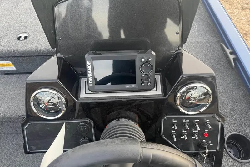 Slide: The Image of Dashboard of a 2026 Lowe Stinger 195 Bass boat with gauges and controls. - 10
