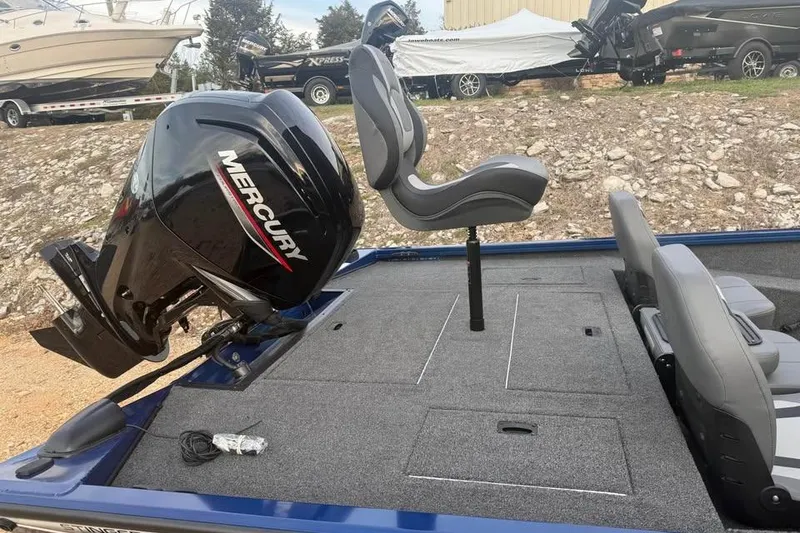 Slide: The Image of 2026 Lowe Stinger 195 Bass boat with Mercury engine and swivel seat on deck. - 7