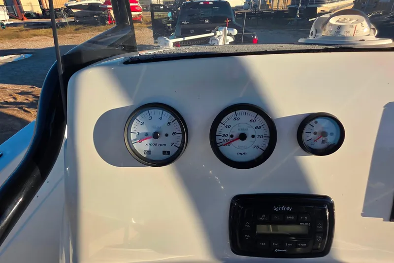 Slide: The Image of Dashboard of 2017 NauticStar 231 Angler boat with gauges and controls. - 15