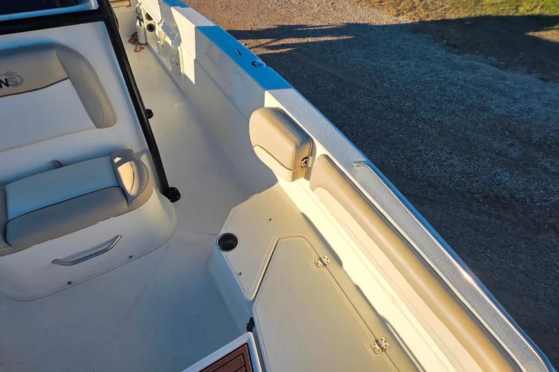 Slide: The Image of 2017 NauticStar 231 Angler boat interior with seating and storage compartments. - 21