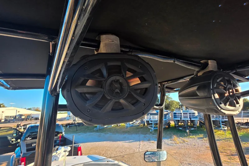 Slide: The Image of Speakers mounted on a 2017 NauticStar 231 Angler boat's T-top frame. - 30