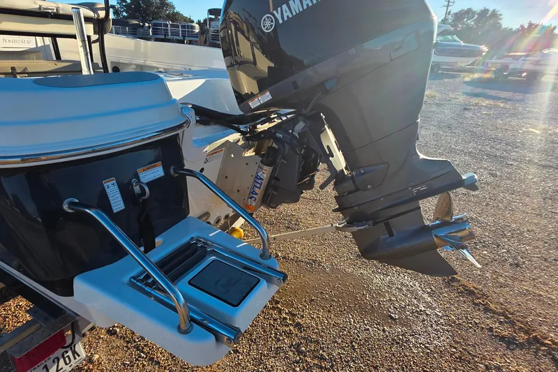 Slide: The Image of 2017 NauticStar 231 Angler with Yamaha outboard motor in a sunny outdoor setting. - 7