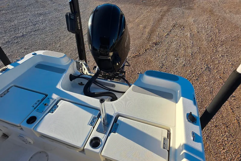 Slide: The Image of 2017 NauticStar 231 Angler boat with motor and storage compartments. - 8