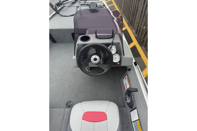 Slide: The Image of 2015 Tracker Pro 160 boat interior with steering wheel and gauges. - 3