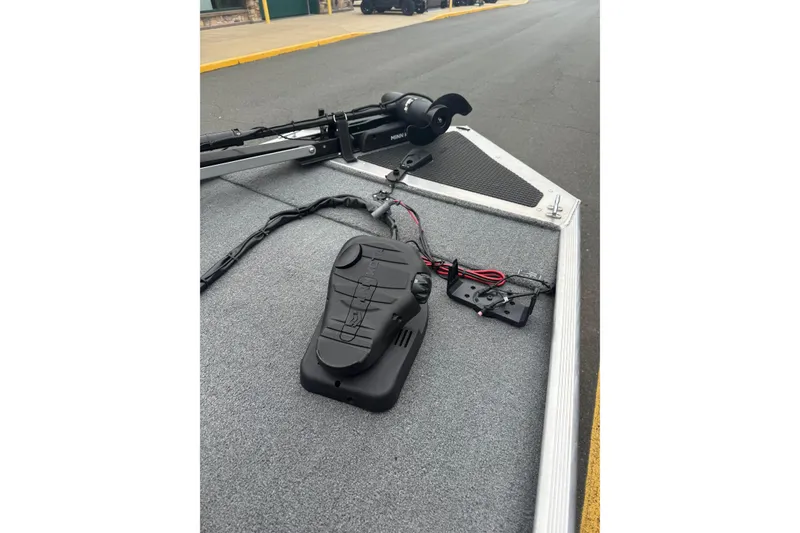 Slide: The Image of 2015 Tracker Pro 160 boat deck with trolling motor and foot pedal controls. - 7