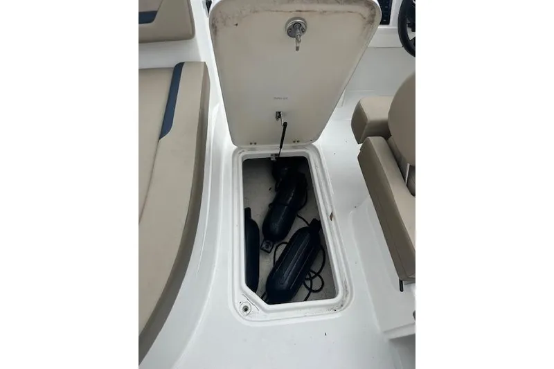 Slide: The Image of Open storage compartment on 2023 Hurricane SunDeck Sport 205 OB boat. - 12