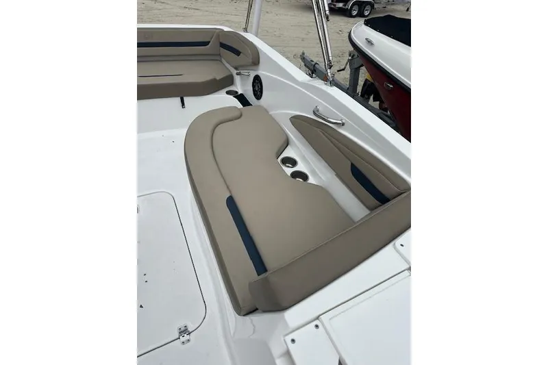 Slide: The Image of 2023 Hurricane SunDeck Sport 205 OB boat interior with beige seating and cup holders. - 14