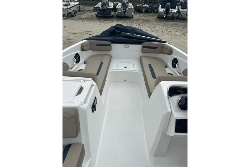 Slide: The Image of 2023 Hurricane SunDeck Sport 205 OB boat interior with beige seating and white deck. - 15