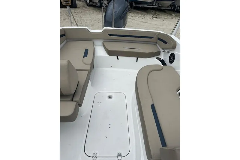 Slide: The Image of 2023 Hurricane SunDeck Sport 205 OB boat interior with beige seating and spacious layout. - 3