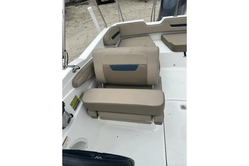 Slide: The Image of 2023 Hurricane SunDeck Sport 205 OB boat interior with beige seating and white deck. - 8