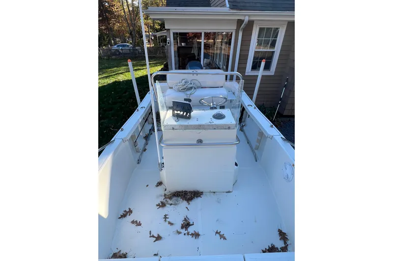 Slide: The Image of 1994 Stratos 1850 Center Console boat at a supply company, viewed from above. - 6