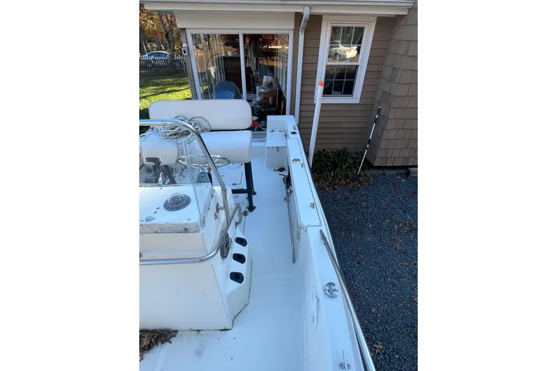 Slide: The Image of 1994 Stratos 1850 Center Console boat interior with steering wheel and control panel. - 9