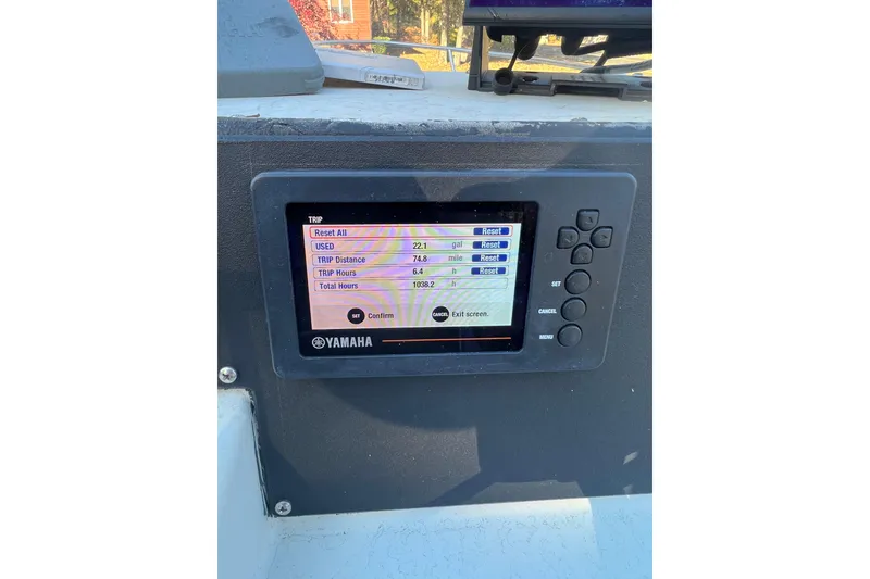Slide: The Image of 1994 Stratos 1850 Center Console with Yamaha display showing trip data and settings. - 14