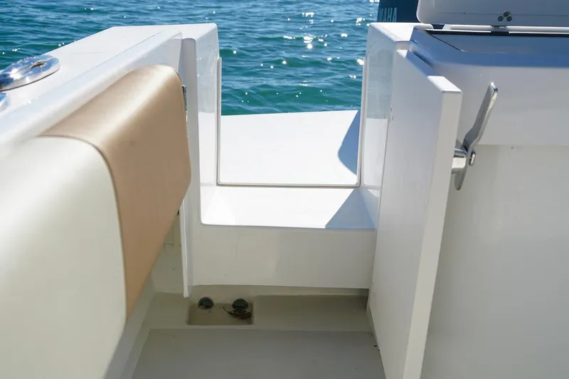 Slide: The Image of Manufacturer Provided Image: 2019 Parker 2520 XL Sport Cabin boat interior with open door and ocean view. - 10