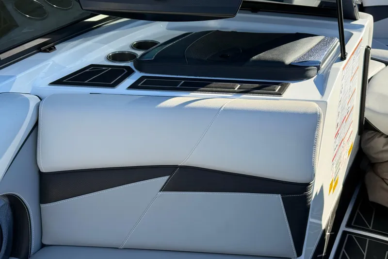 Slide: The Image of 2019 Centurion Fi25 boat interior with sleek seating and cup holders. - 15