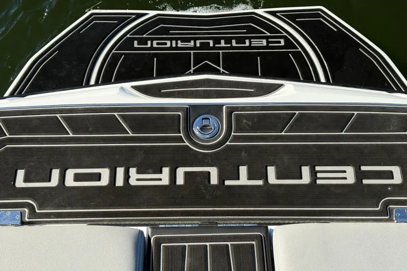 Slide: The Image of 2019 Centurion Fi25 boat deck with logo, viewed from above on water. - 21