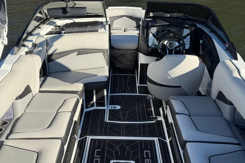 Slide: The Image of 2019 Centurion Fi25 boat interior with modern seating and sleek dashboard design. - 23