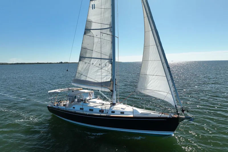 The Image of Sailing yacht Tartan 4000, 2013 model, gliding on open water under clear blue skies. - 0
