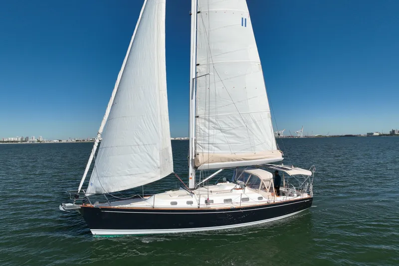 Slide: The Image of Sailing yacht Tartan 4000, 2013 model, cruising on open water under clear blue skies. - 10