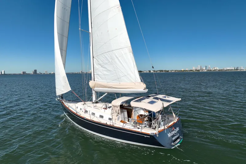 Slide: The Image of Sailing yacht Tartan 4000, 2013 model, cruising on open water under clear blue skies. - 11