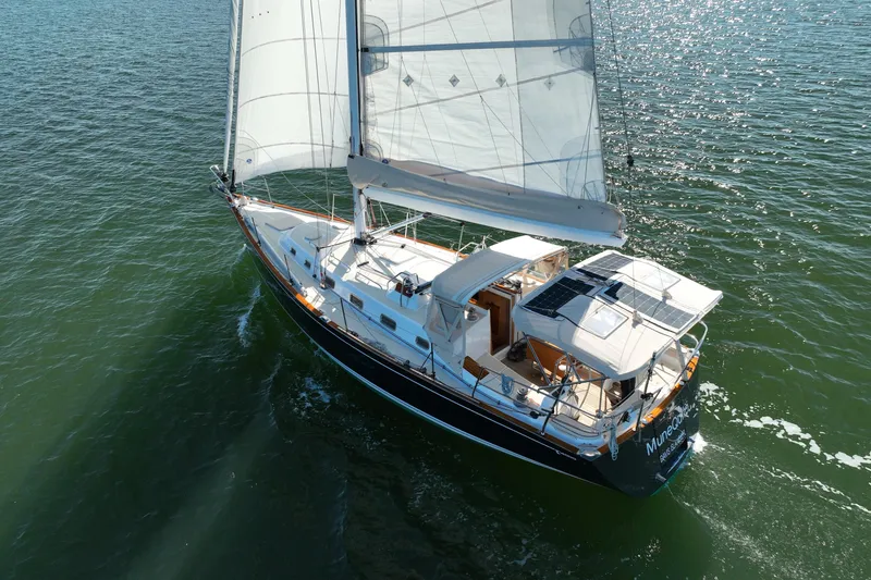 Slide: The Image of Sailing yacht Tartan 4000 (2013) gliding on open water with full sails. - 12