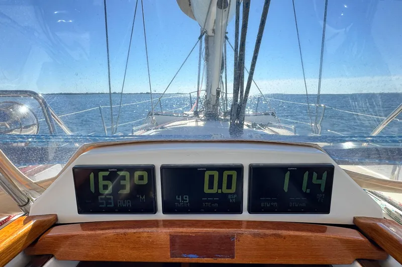 Slide: The Image of Sailing on a 2013 Tartan 4000 yacht with digital navigation displays. - 21