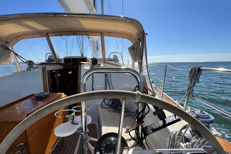 Slide: The Image of Sailing yacht Tartan 4000, 2013 model, steering wheel view on open sea. - 22