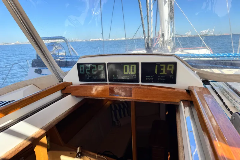 Slide: The Image of Cockpit view of 2013 Tartan 4000 sailboat with digital navigation displays. - 24