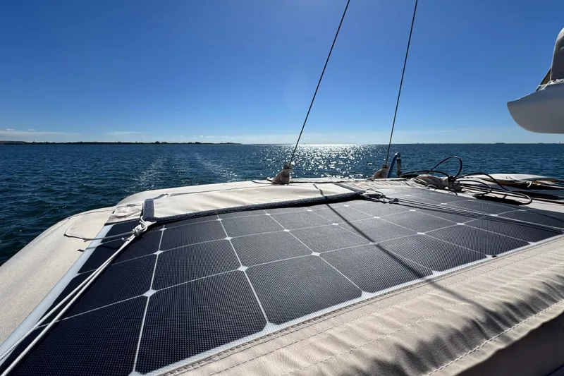 Slide: The Image of Sailboat with solar panels on deck, Tartan 4000, 2013 model, cruising on sunny ocean. - 32