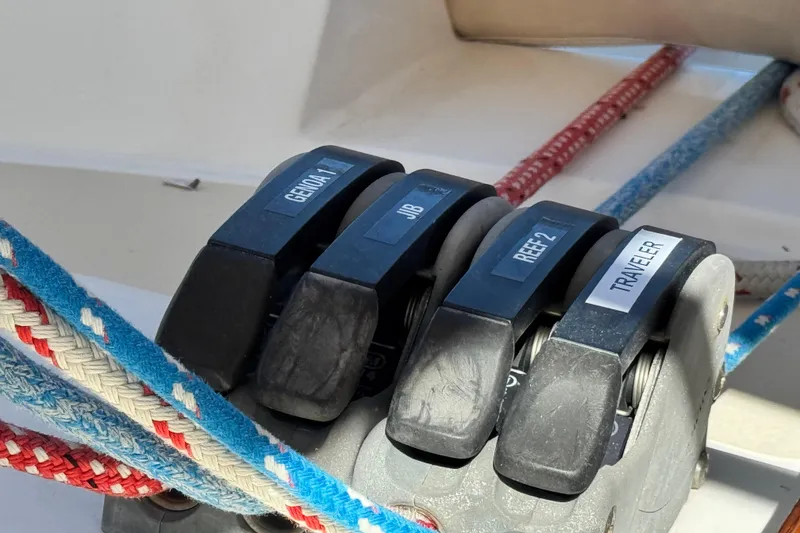 Slide: The Image of Sailboat control panel with labeled rope clutches on a 2013 Tartan 4000. - 43