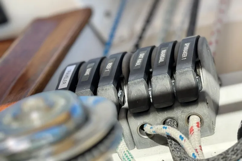 Slide: The Image of Close-up of Tartan 4000 sailboat control levers, 2013 model, labeled for various functions. - 44