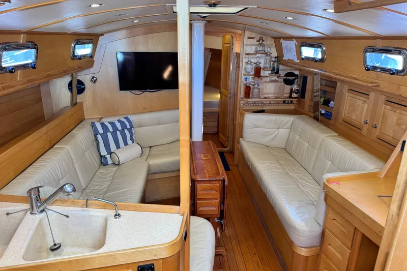 Slide: The Image of Luxurious interior of a 2013 Tartan 4000 yacht with leather seating and wooden finishes. - 49