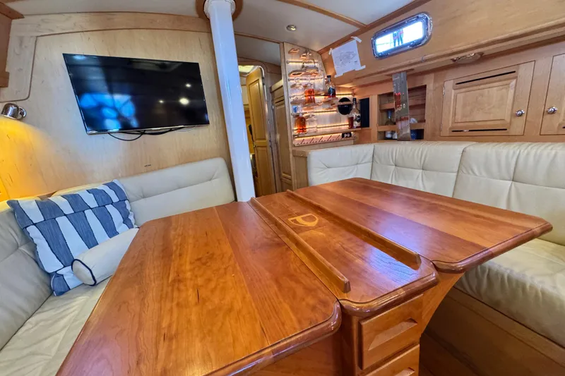 Slide: The Image of Luxurious interior of 2013 Tartan 4000 yacht with wooden table and plush seating. - 56