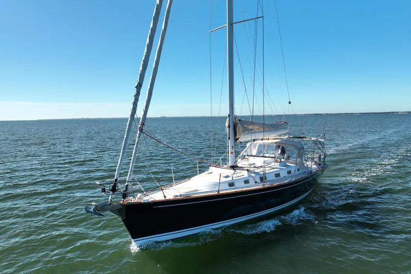 Slide: The Image of Sailing yacht Tartan 4000, 2013 model, cruising on open water under clear blue skies. - 6